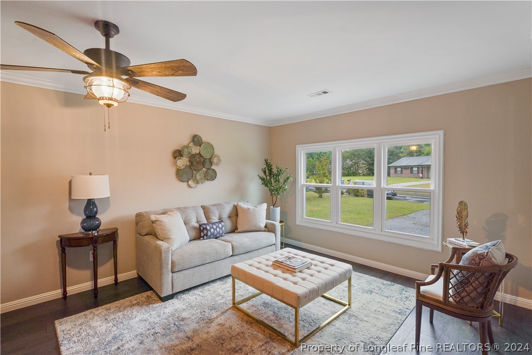 6481 Green Meadow Road Fayetteville, NC 28304 - Photo 12 of 33 a living room with furniture and a window
