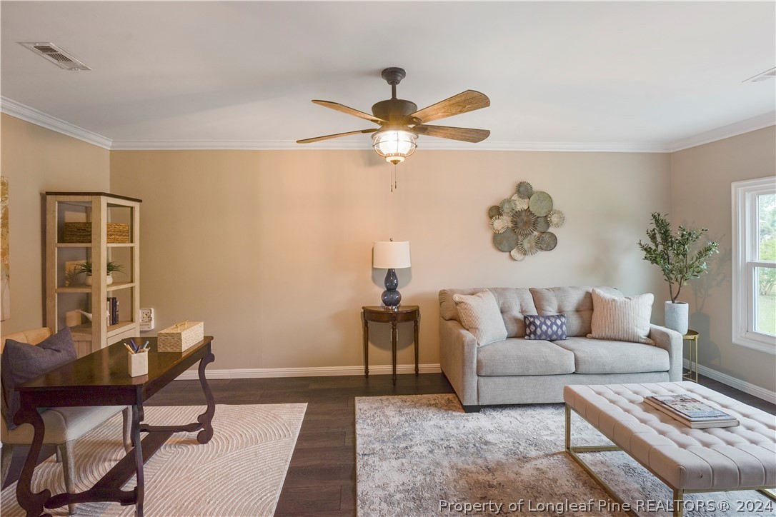 6481 Green Meadow Road Fayetteville, NC 28304 - Photo 13 of 33 a living room with furniture and a window