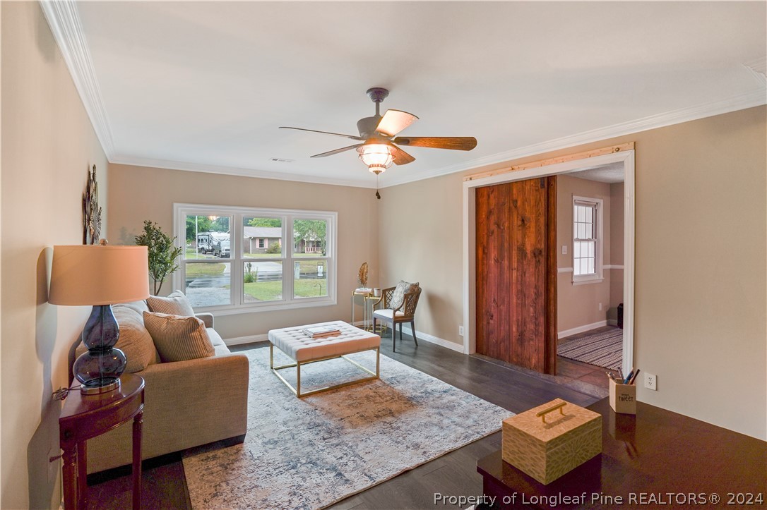 6481 Green Meadow Road Fayetteville, NC 28304 - Photo 14 of 33 a living room with furniture and a window