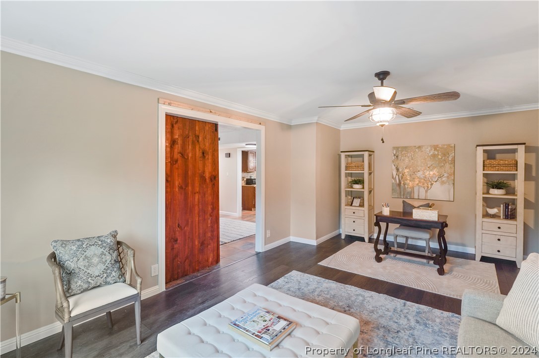 6481 Green Meadow Road Fayetteville, NC 28304 - Photo 15 of 33 a living room with furniture and wooden floor