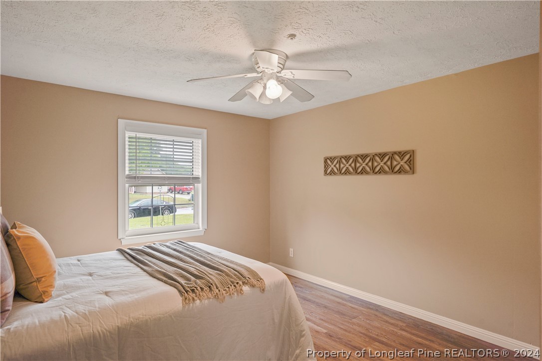 6481 Green Meadow Road Fayetteville, NC 28304 - Photo 29 of 33 a bedroom with a bed and a window
