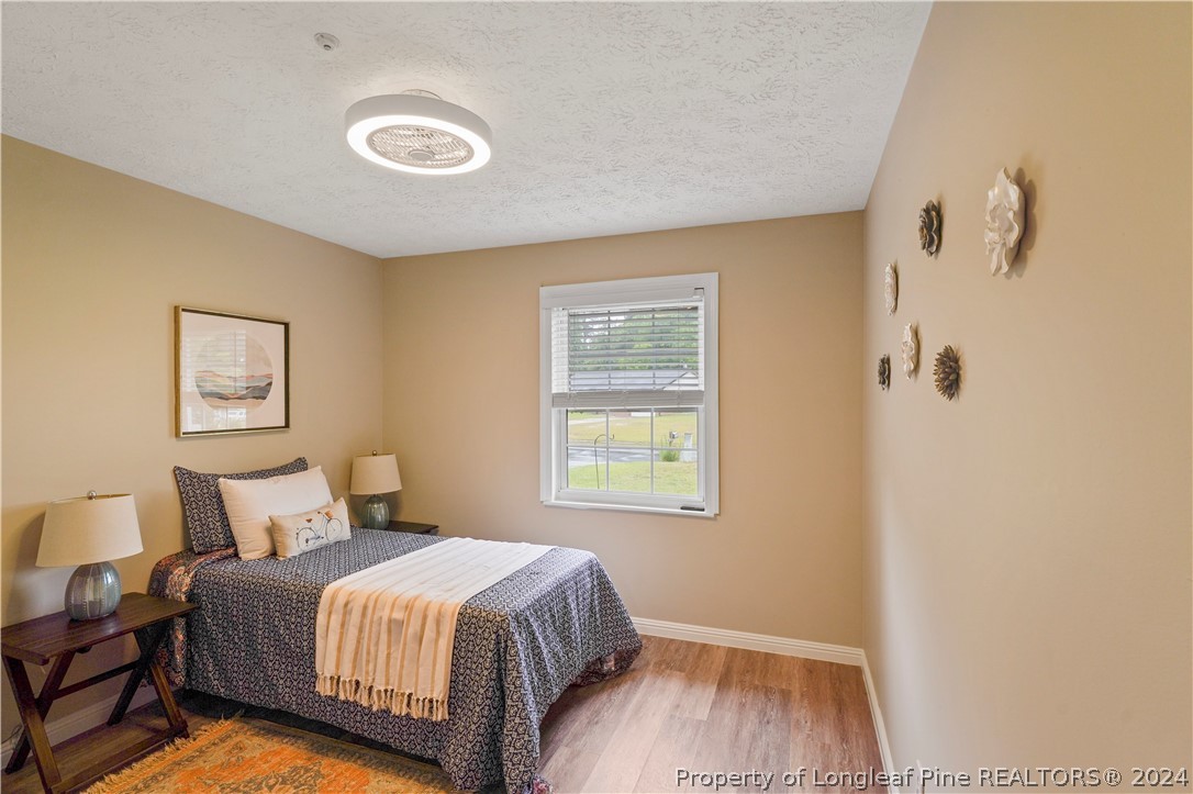 6481 Green Meadow Road Fayetteville, NC 28304 - Photo 32 of 33 a bedroom with a bed and a window