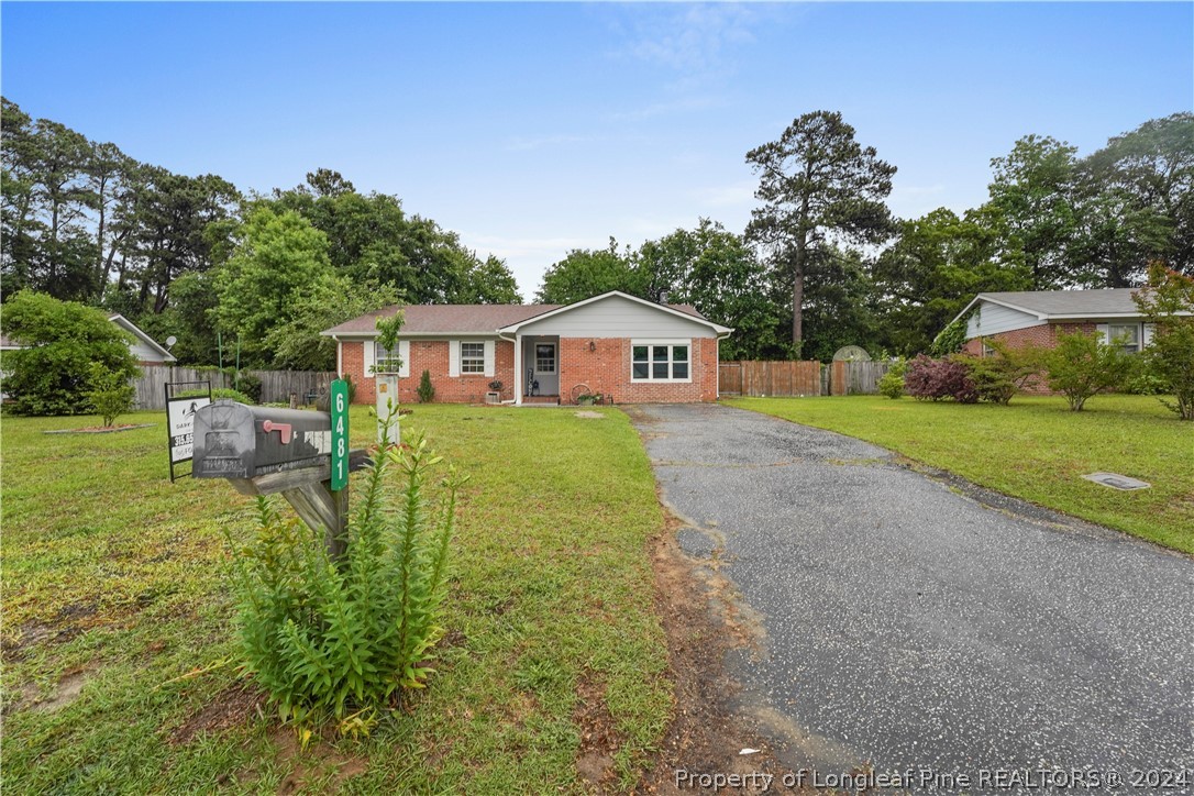 6481 Green Meadow Road Fayetteville, NC 28304 - Photo 6 of 33 a house view with swimming pool and garden space