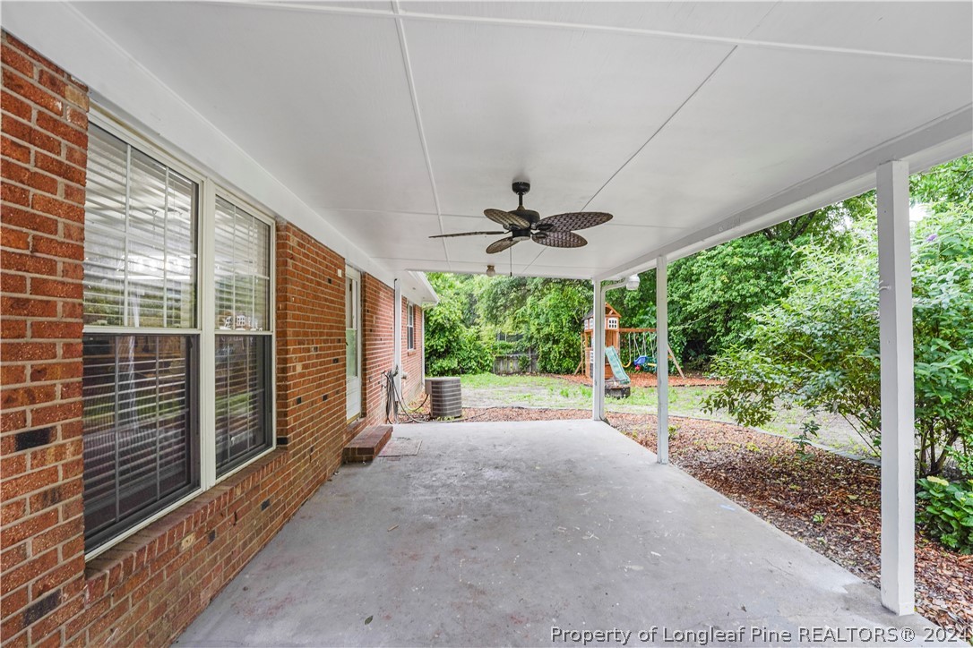 6481 Green Meadow Road Fayetteville, NC 28304 - Photo 7 of 33 a view of a porch with a yard