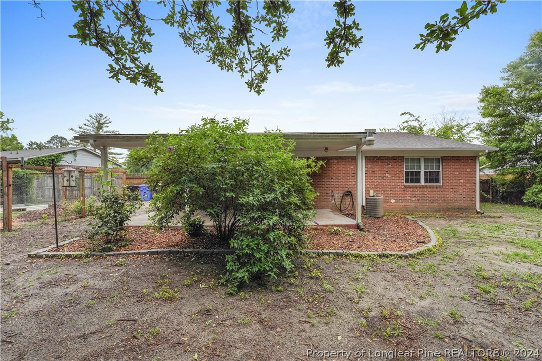 6481 Green Meadow Road Fayetteville, NC 28304 - Photo 10 of 33 a view of a house with a yard and tree s