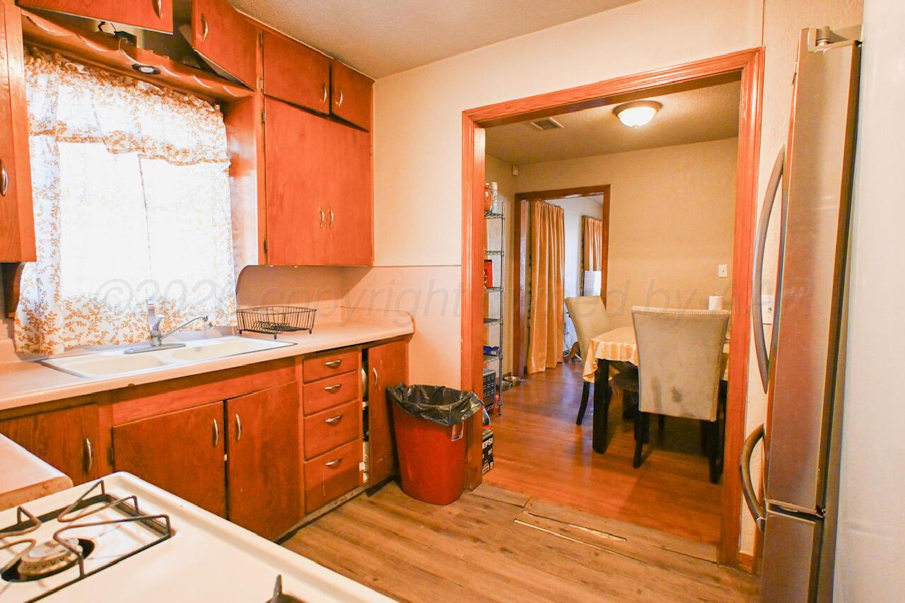 1313 Southwest 15th Avenue Amarillo, TX 79102 - Photo 3 of 15 a bathroom with a sink and a mirror
