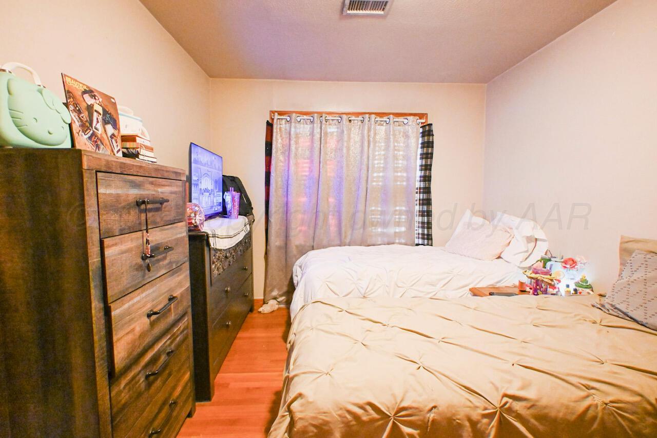 1313 Southwest 15th Avenue Amarillo, TX 79102 - Photo 5 of 15 a bedroom with a bed and a window