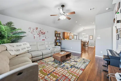 a living room with furniture and a rug