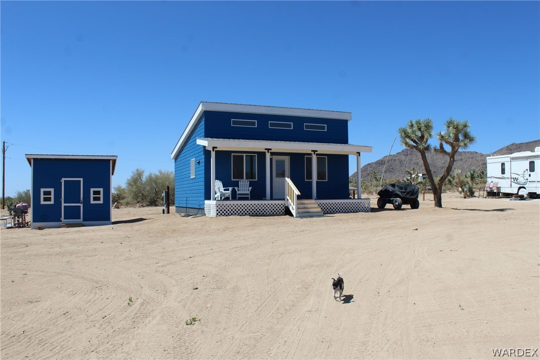 11722 Suzette Road Yucca, AZ 86438 - Photo 1 of 29 a view of a house with a outdoor space