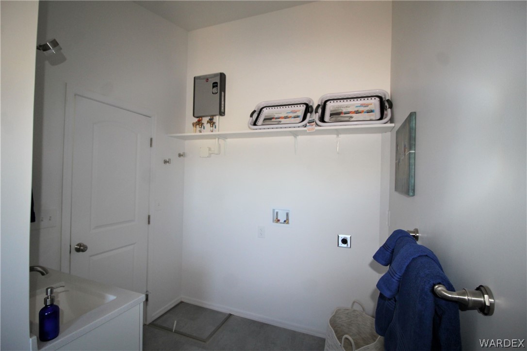 11722 Suzette Road Yucca, AZ 86438 - Photo 15 of 29 a bathroom with a sink and mirror