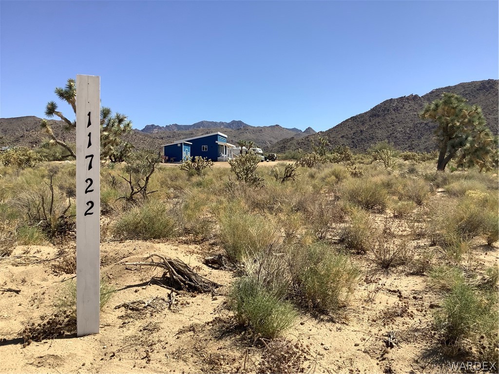 11722 Suzette Road Yucca, AZ 86438 - Photo 2 of 29 a view of a house with a mountain