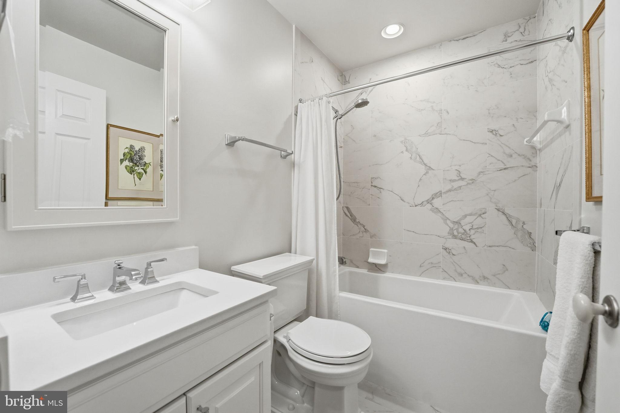 207B Locust Street Southeast Vienna, VA 22180 - Photo 25 of 33 Remodeled hall bath with soaking tub