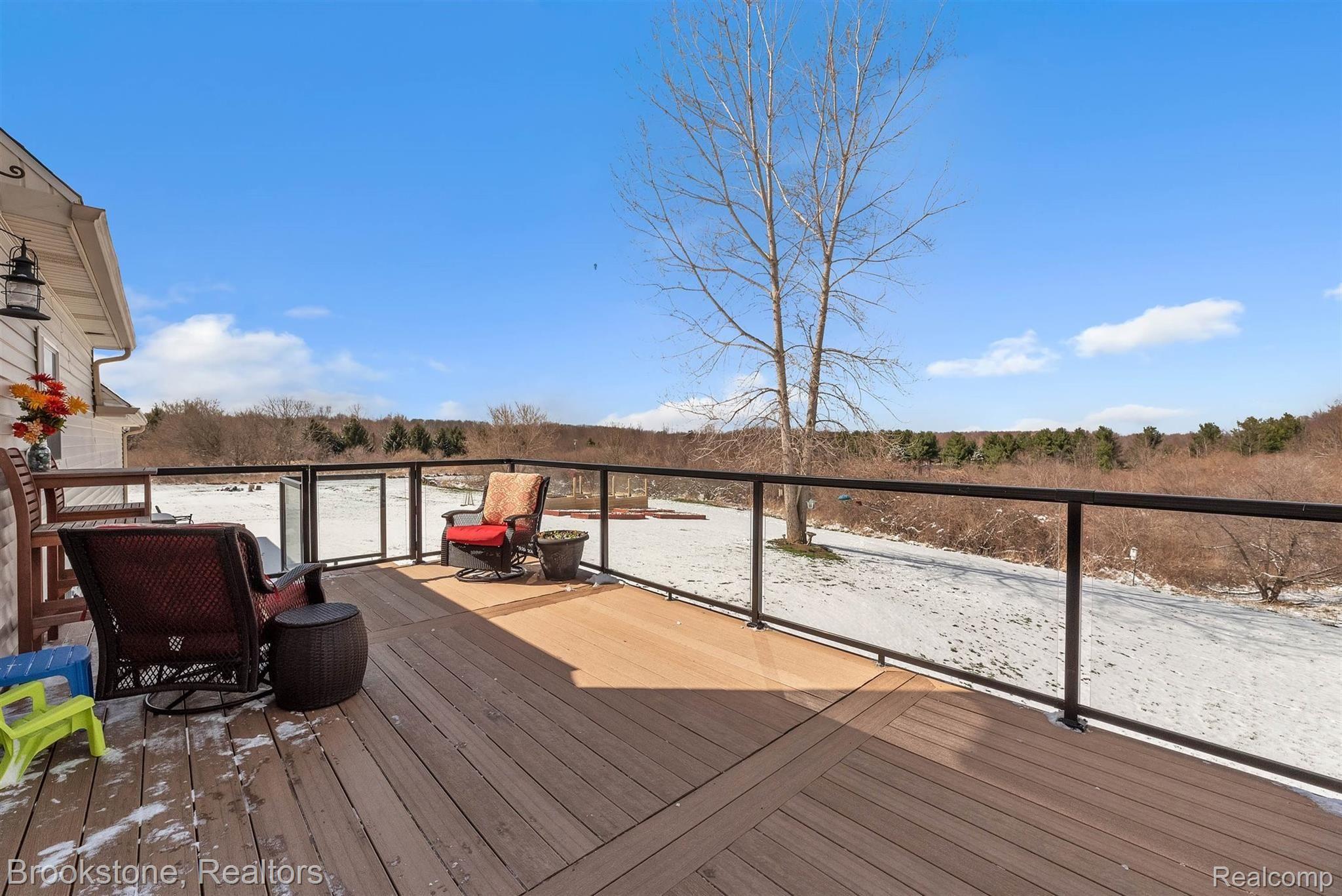 3881 East Hunters Creek Road Metamora, MI 48455 - Photo 45 of 55 Trex deck w/glass paneling