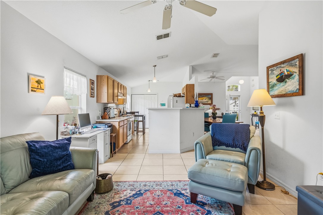 131 Bellamy Trail Sebastian, FL 32958 - Photo 14 of 32 a living room with furniture and kitchen view