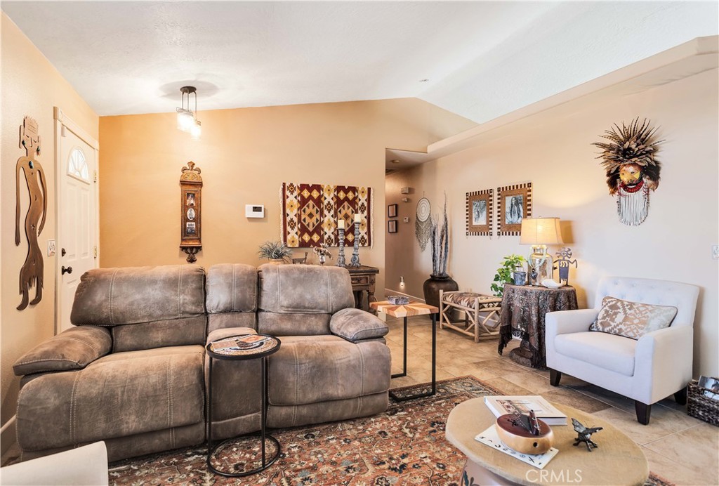 57490 Redondo Street Yucca Valley, CA 92284 - Photo 13 of 60 a living room with furniture and a couch