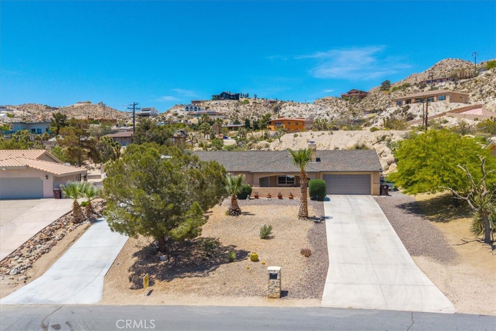 57490 Redondo Street Yucca Valley, CA 92284 - Photo 2 of 60 a view of a city with tall buildings
