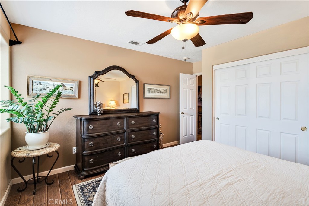 57490 Redondo Street Yucca Valley, CA 92284 - Photo 24 of 60 a bedroom with a bed and a dresser