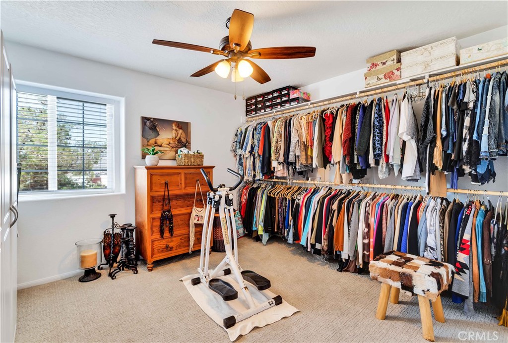 57490 Redondo Street Yucca Valley, CA 92284 - Photo 26 of 60 a view of walk in closet with clothes and shoes