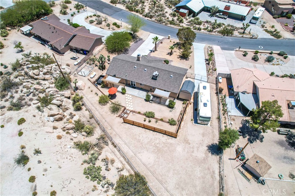 57490 Redondo Street Yucca Valley, CA 92284 - Photo 48 of 60 an aerial view of residential houses with outdoor space