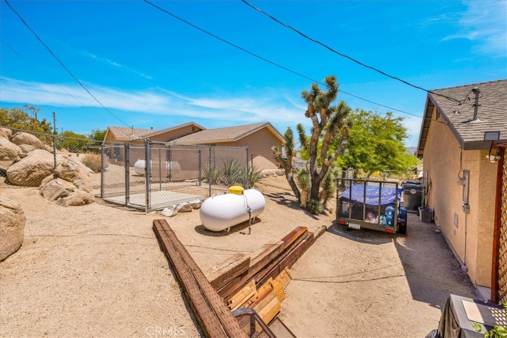 57490 Redondo Street Yucca Valley, CA 92284 - Photo 49 of 60 a view of a chairs and tables in the patio