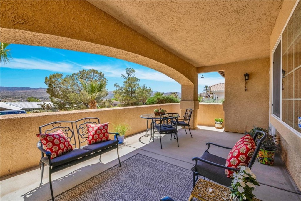 57490 Redondo Street Yucca Valley, CA 92284 - Photo 5 of 60 a outdoor space with patio the couch and a potted plant