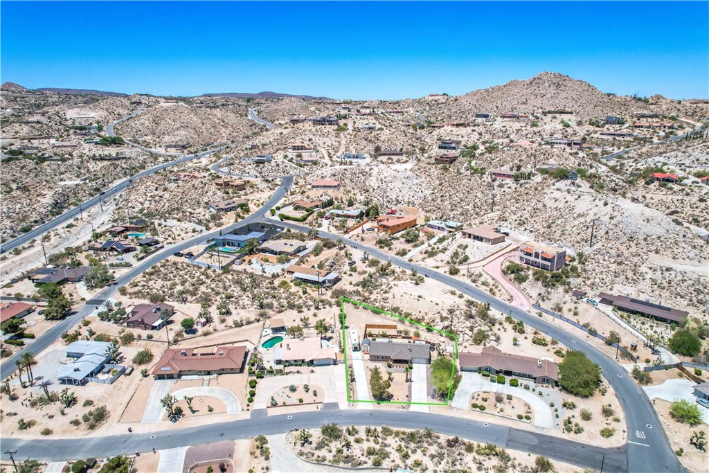 57490 Redondo Street Yucca Valley, CA 92284 - Photo 54 of 60 an aerial view of residential houses with outdoor space