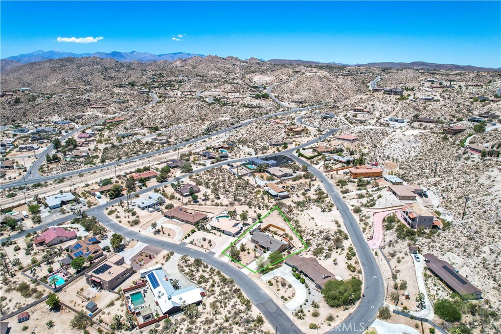 57490 Redondo Street Yucca Valley, CA 92284 - Photo 55 of 60 an aerial view of residential houses with outdoor space