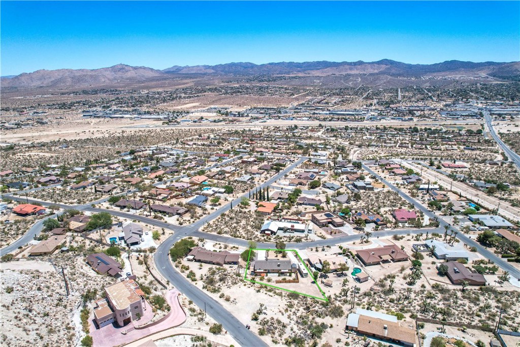 57490 Redondo Street Yucca Valley, CA 92284 - Photo 57 of 60 an aerial view of residential house and sandy dunes