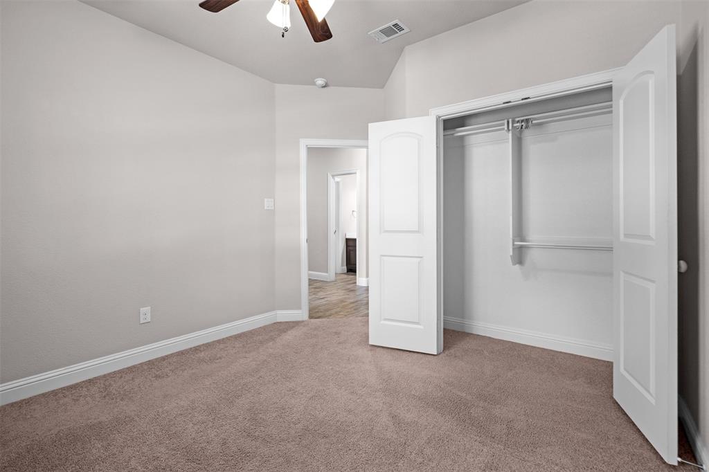 119 Happy Lane Red Oak, TX 75154 - Photo 30 of 37 Carpeted room featuring a ceiling fan with light fixture, vaulted ceiling, and base molding