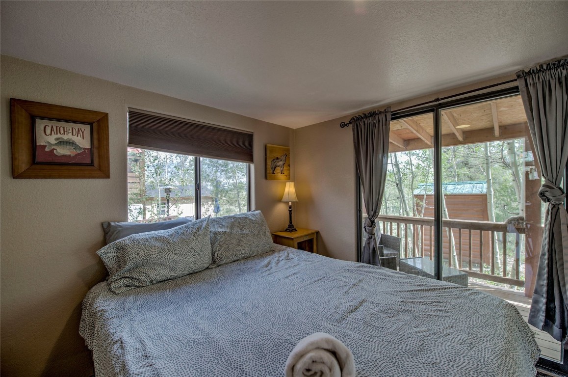 122 Sunshine Loop Fairplay, CO 80440 - Photo 12 of 28 a bed sitting in a bedroom next to a window