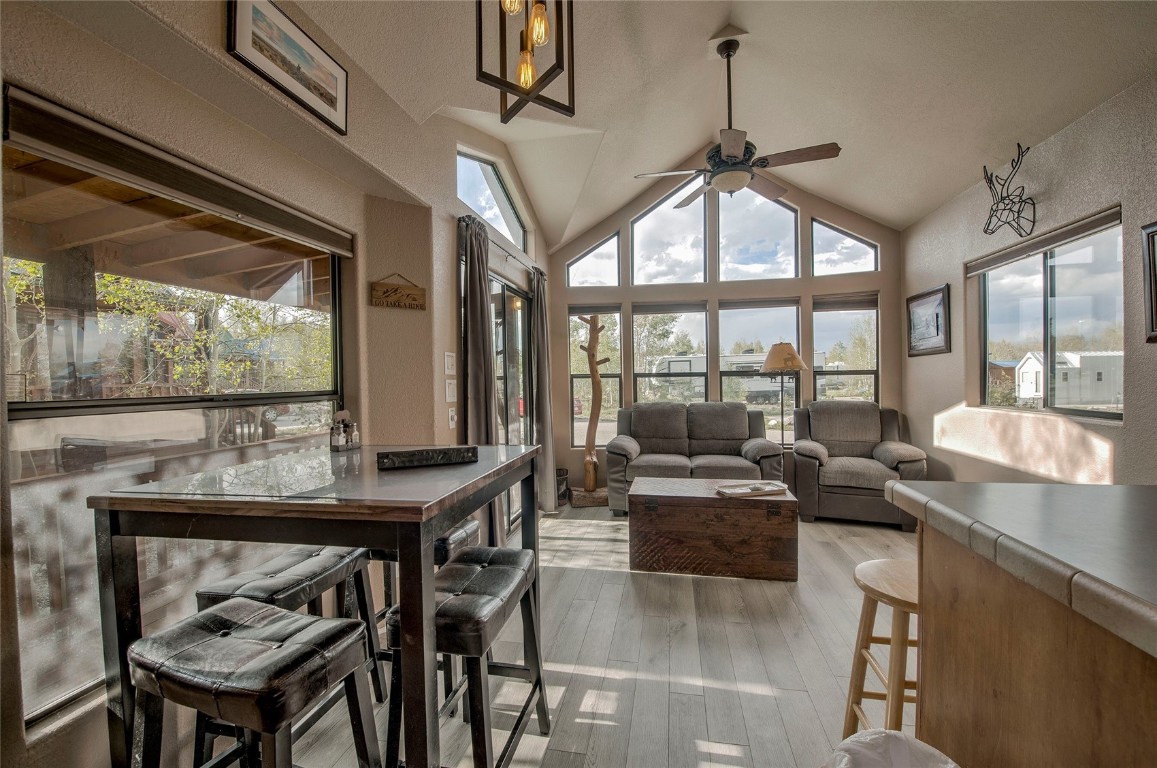 122 Sunshine Loop Fairplay, CO 80440 - Photo 2 of 28 a living room with furniture and a floor to ceiling window