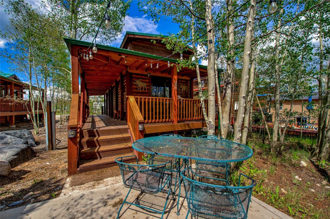 122 Sunshine Loop Fairplay, CO 80440 - Photo 24 of 28 a backyard of a house with barbeque oven table and chairs