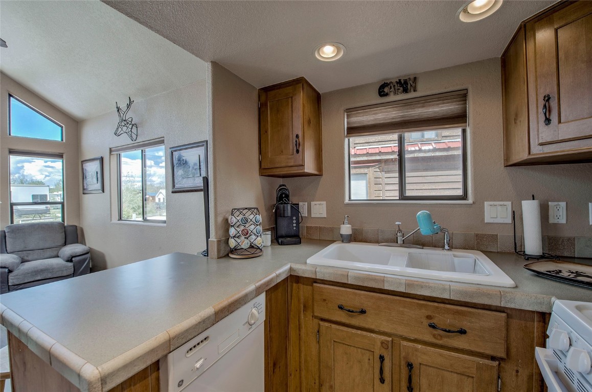 122 Sunshine Loop Fairplay, CO 80440 - Photo 8 of 28 a kitchen with a sink a window and cabinets