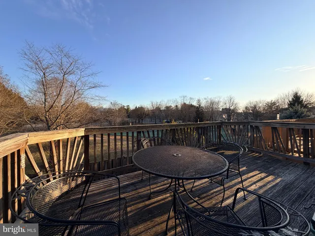 a view of a chairs and table in the balcony