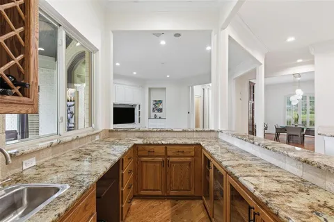 a kitchen with a stove and a sink