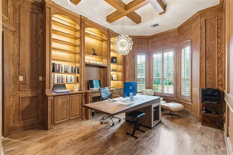 a living room with furniture a rug and a large window