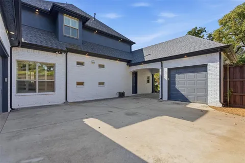 an aerial view of a house with outdoor space