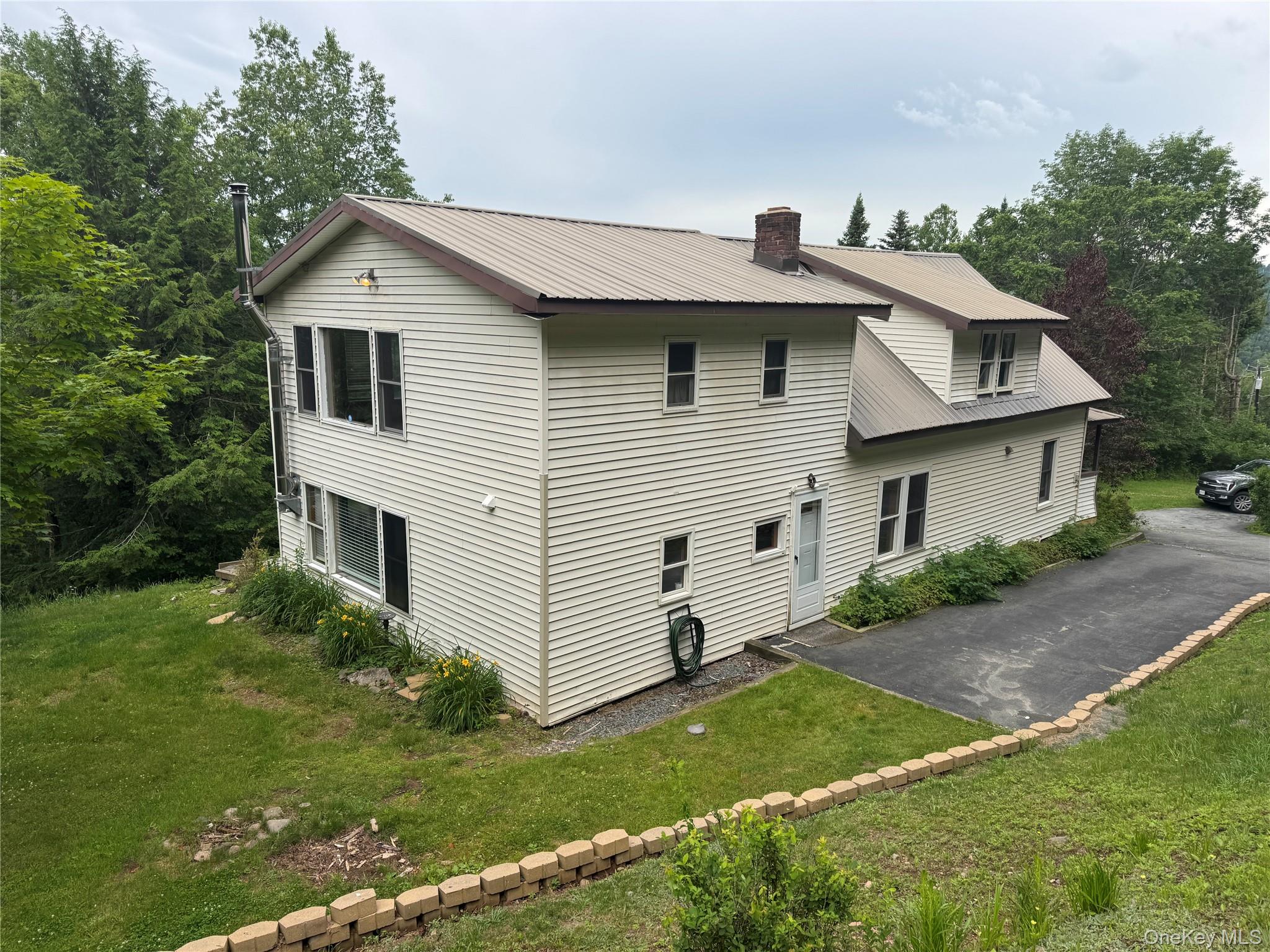 96 White Roe Lake Road Livingston Manor, NY 12758 - Photo 2 of 34 a view of a house with a yard
