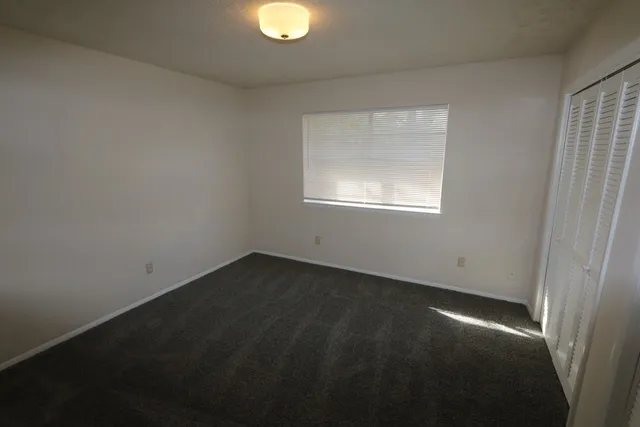 an empty room with a empty space and a window