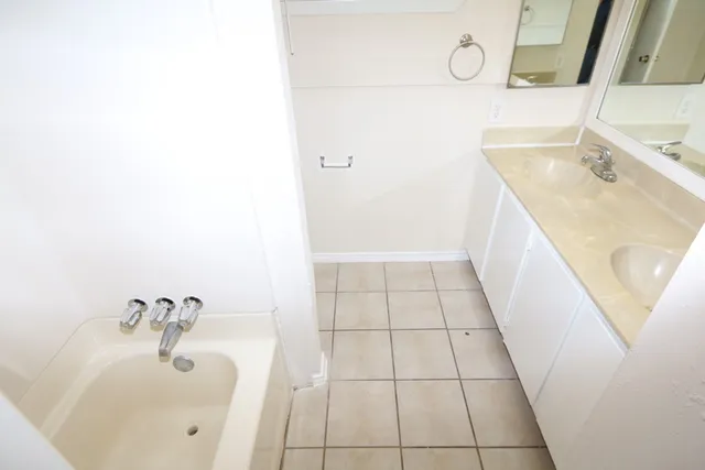 a bathroom with a sink and mirror