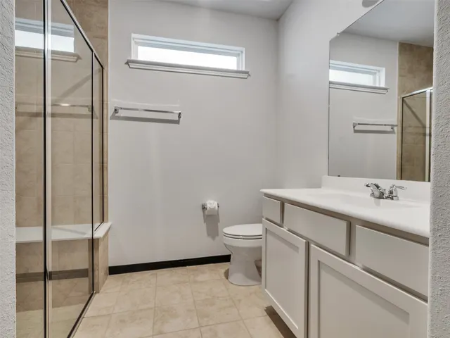 a kitchen with stainless steel appliances a sink stove and cabinets