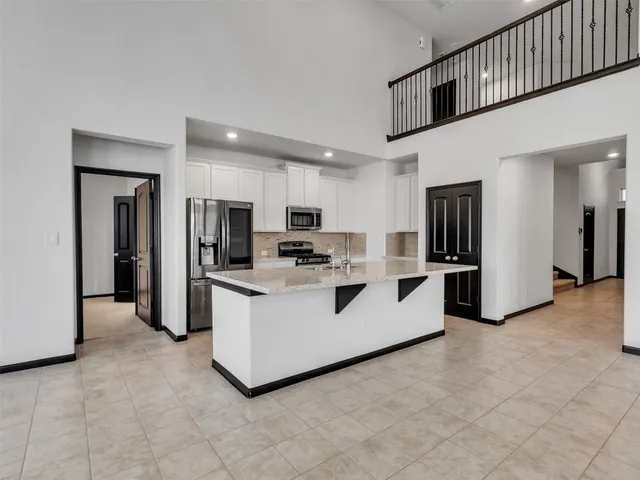 a white toilet sitting next to a bathroom sink