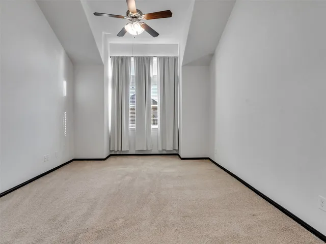 a view of a house with a big yard and large trees