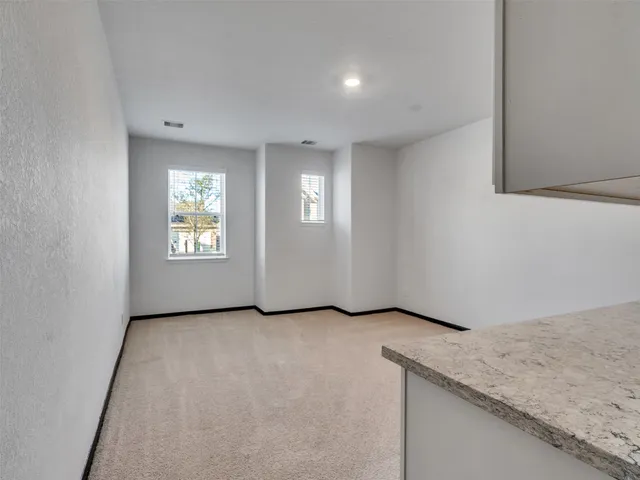a kitchen with stainless steel appliances granite countertop a refrigerator stove and sink
