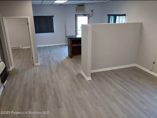 a view of a chairs and table in a patio