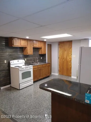 a bathroom with a shower and toilet