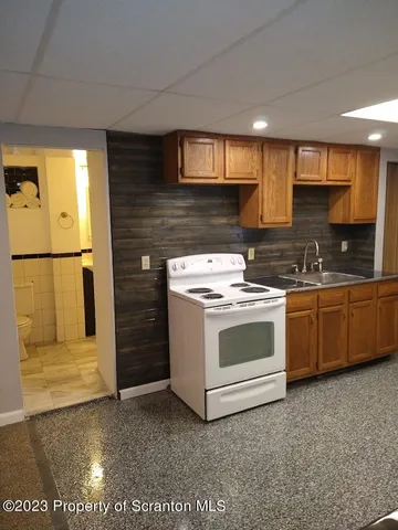 a view of an empty room and wooden floor