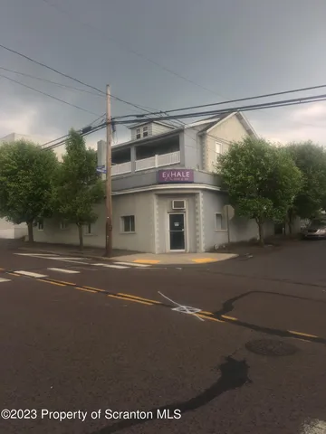 a view of a street with a building in the background