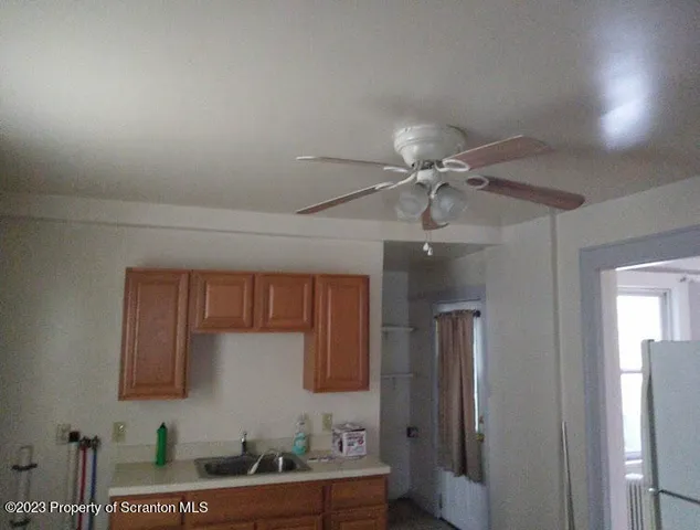 a kitchen with a sink and a stove