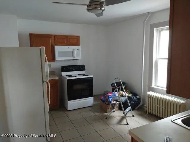 a view of swimming pool with sitting area